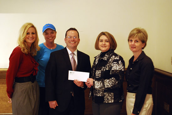 (L-R) Bevin Lamb, Senior Alumni Secretary, Liza Vaughn, Assistant Director of Alumni Affairs, John C. Cox, Past President of the National Alumni Association Board of Directors, accepting the sponsorship check from Vicki Bingham, Associate Professor & Chair of the School of Nursing, and Lisa Ellis ’97  graduate of the School of Nursing.